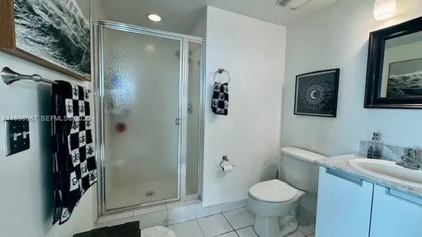 a bathroom with a toilet sink and shower