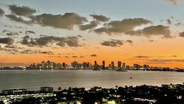 a view of a city and ocean