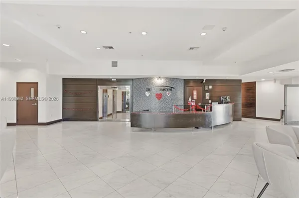 a view of a livingroom with furniture and a flat screen tv