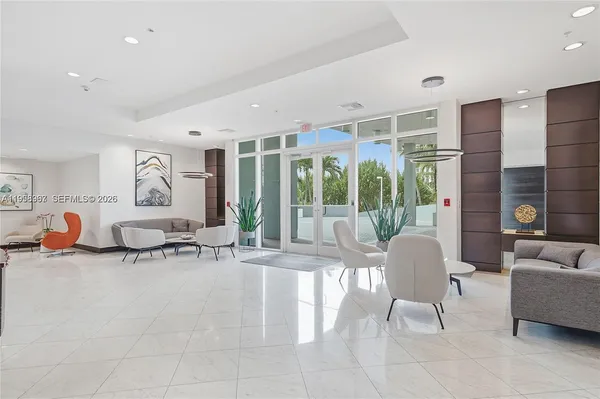 a living room with furniture and a large window