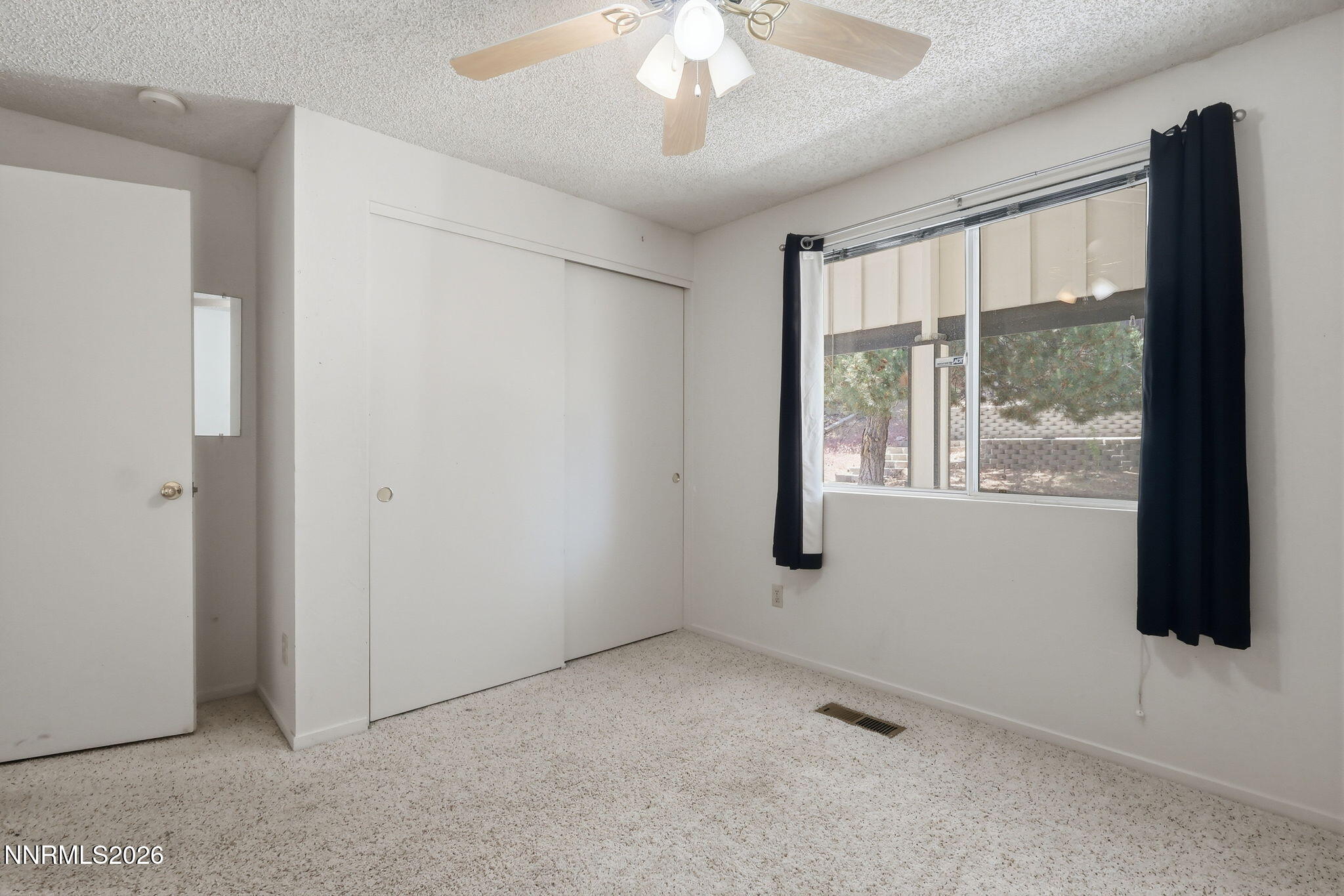 6840 Viscaya Court Reno, NV 89523 - Photo 21 of 25 a view of an empty room with a window