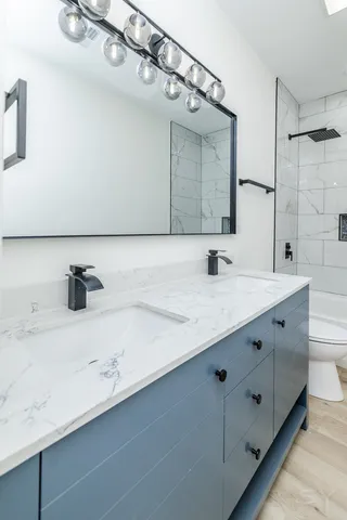 a bathroom with a toilet and a bathtub