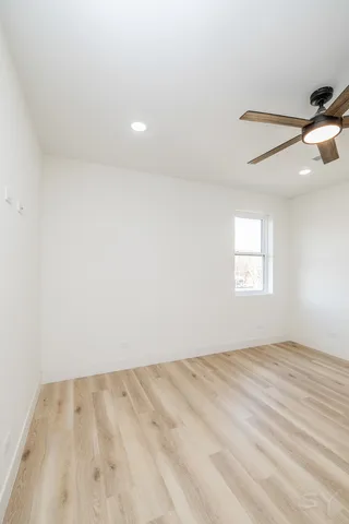 a view of an empty room with closet area