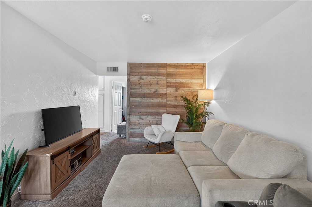 1430 West Lambert Road, Unit 384 La Habra, CA 90631 - Photo 11 of 41 a living room with furniture and a flat screen tv