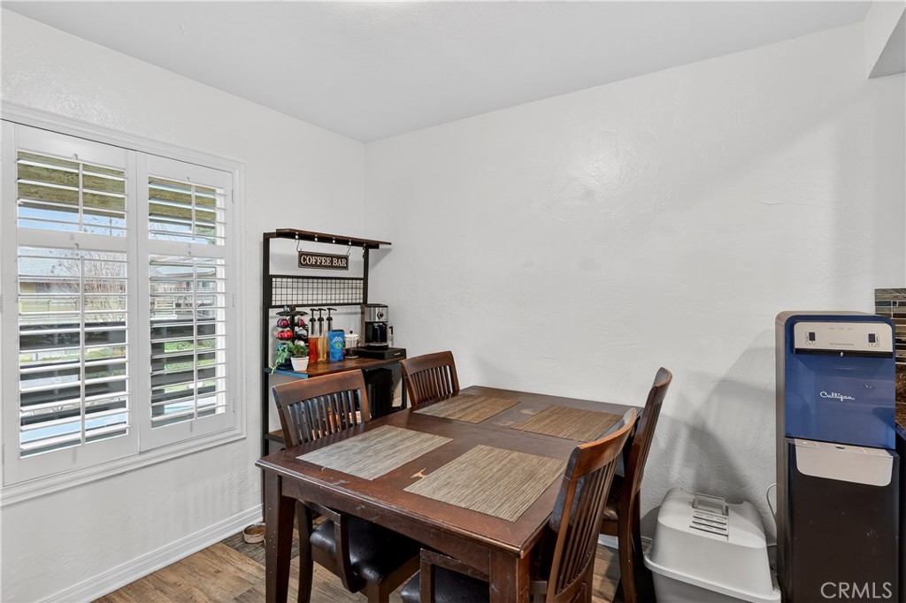 1430 West Lambert Road, Unit 384 La Habra, CA 90631 - Photo 13 of 41 a view of a dining room with furniture and wooden floor
