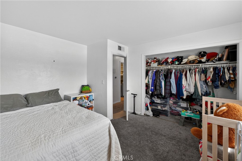 1430 West Lambert Road, Unit 384 La Habra, CA 90631 - Photo 19 of 41 a bedroom with furniture and a closet