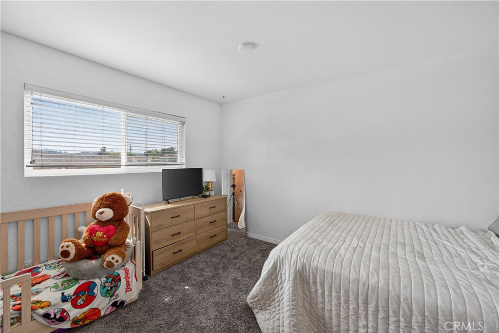 1430 West Lambert Road, Unit 384 La Habra, CA 90631 - Photo 20 of 41 a bedroom with a bed and a window