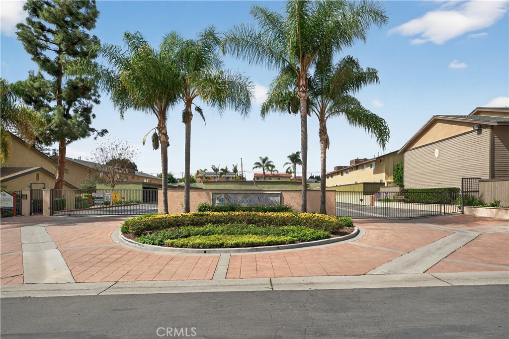 1430 West Lambert Road, Unit 384 La Habra, CA 90631 - Photo 2 of 41 a view of a swimming pool with a yard and palm trees