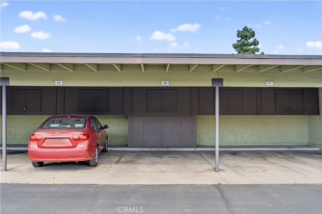 1430 West Lambert Road, Unit 384 La Habra, CA 90631 - Photo 26 of 41 a front view of a house with a garden and parking space