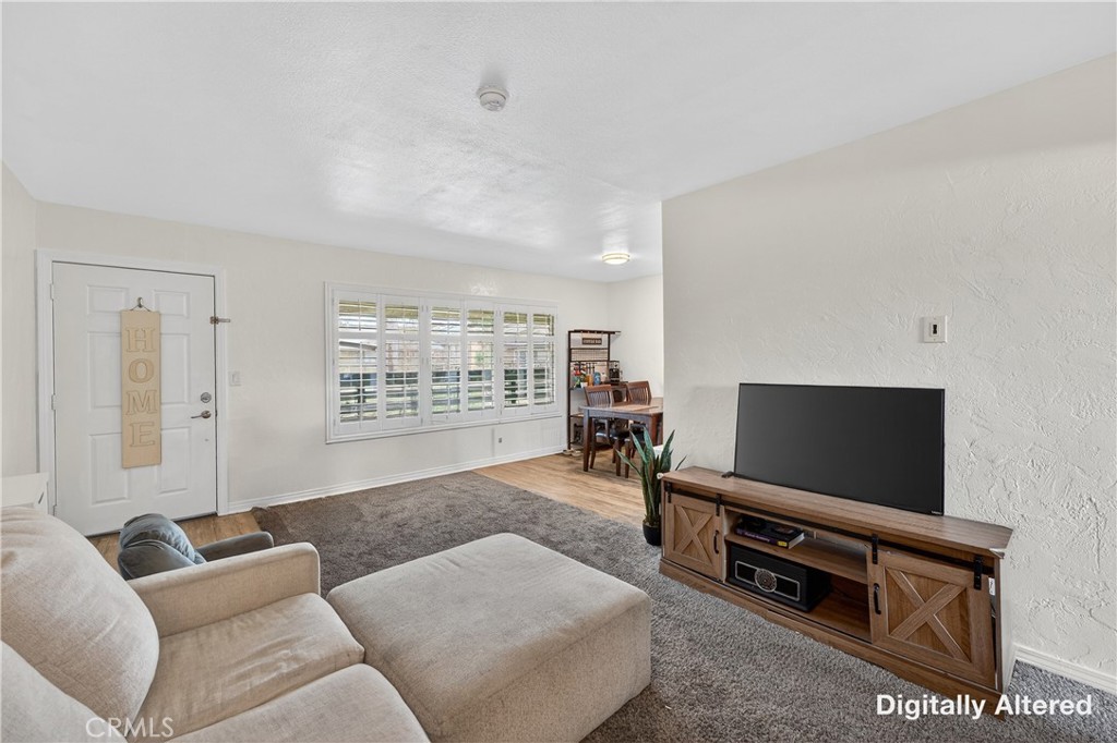 1430 West Lambert Road, Unit 384 La Habra, CA 90631 - Photo 6 of 41 a living room with furniture and a flat screen tv