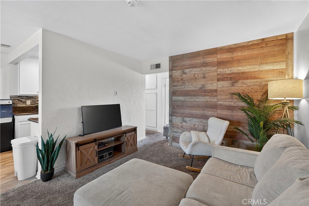 1430 West Lambert Road, Unit 384 La Habra, CA 90631 - Photo 9 of 41 a living room with furniture and a flat screen tv
