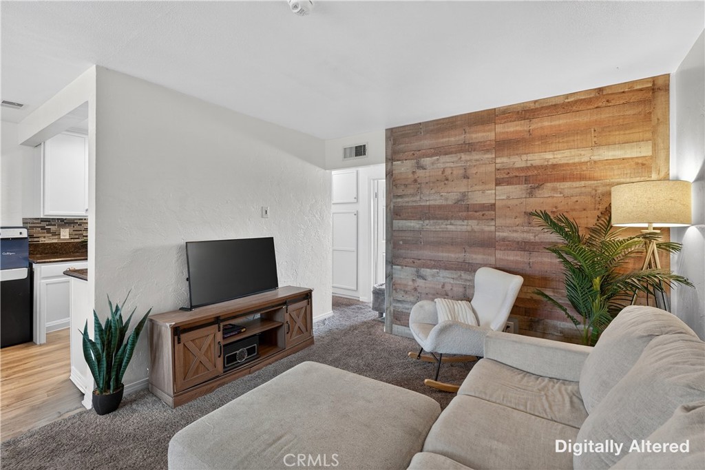 1430 West Lambert Road, Unit 384 La Habra, CA 90631 - Photo 10 of 41 a living room with furniture and a flat screen tv