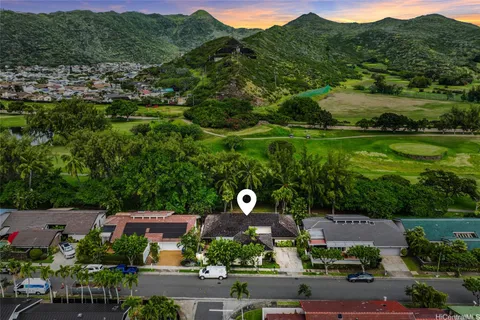 an aerial view of a house with a garden