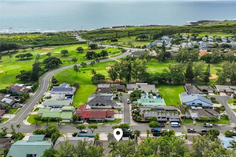 an aerial view of multiple houses with yard