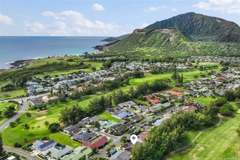 a view of a garden with a building in the background