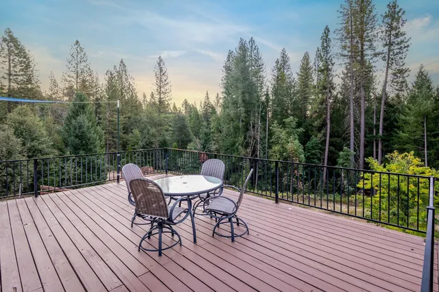 a living room with furniture and large windows