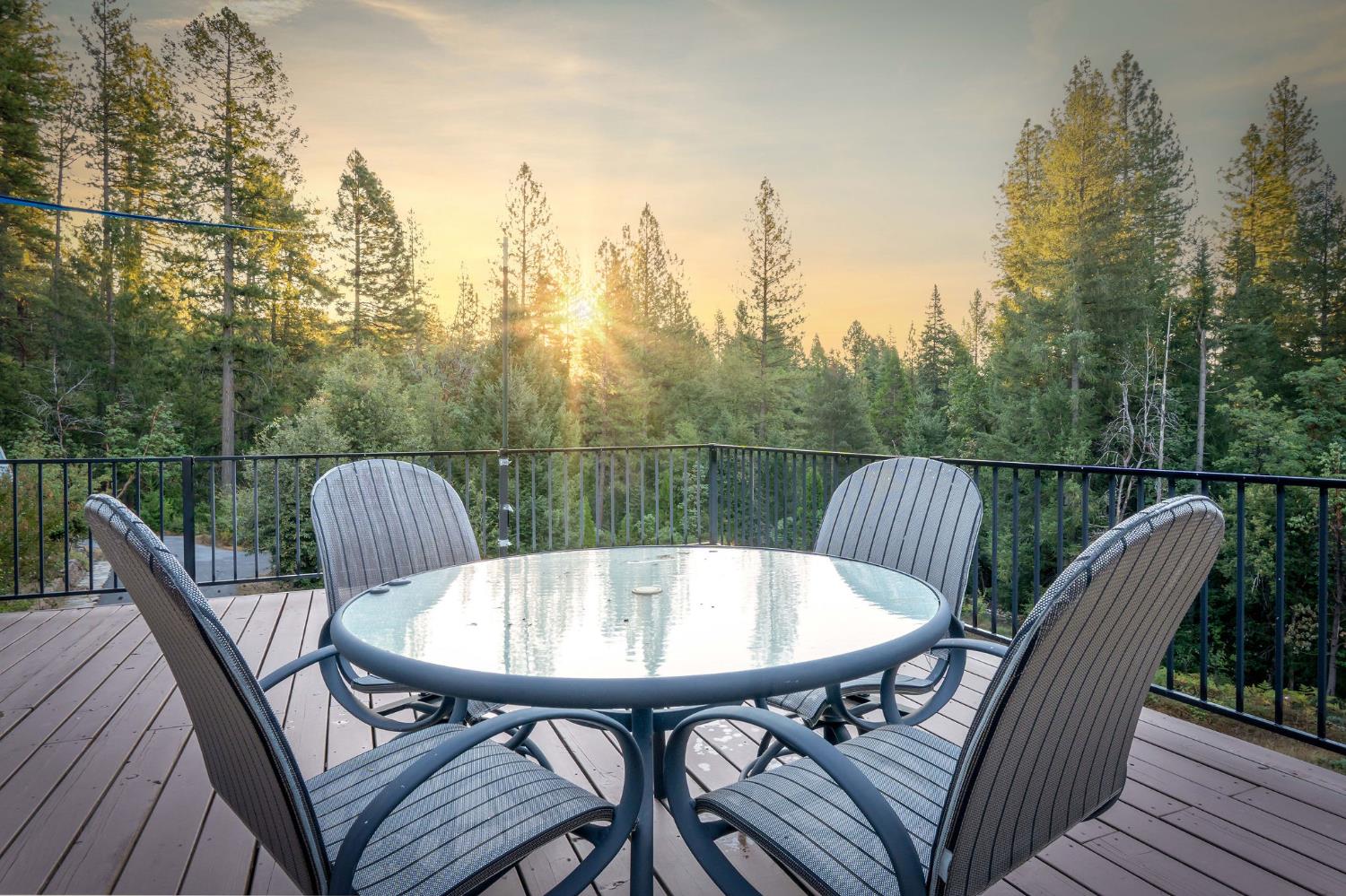 12401 Old Mine Road Grass Valley, CA 95945 - Photo 17 of 87 a view of a balcony with table and chairs