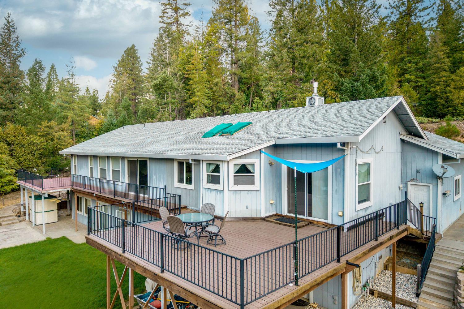 12401 Old Mine Road Grass Valley, CA 95945 - Photo 20 of 87 a view of a house with backyard and sitting area