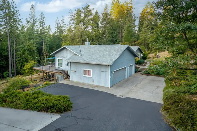 a kitchen with granite countertop wooden cabinets and stainless steel appliances