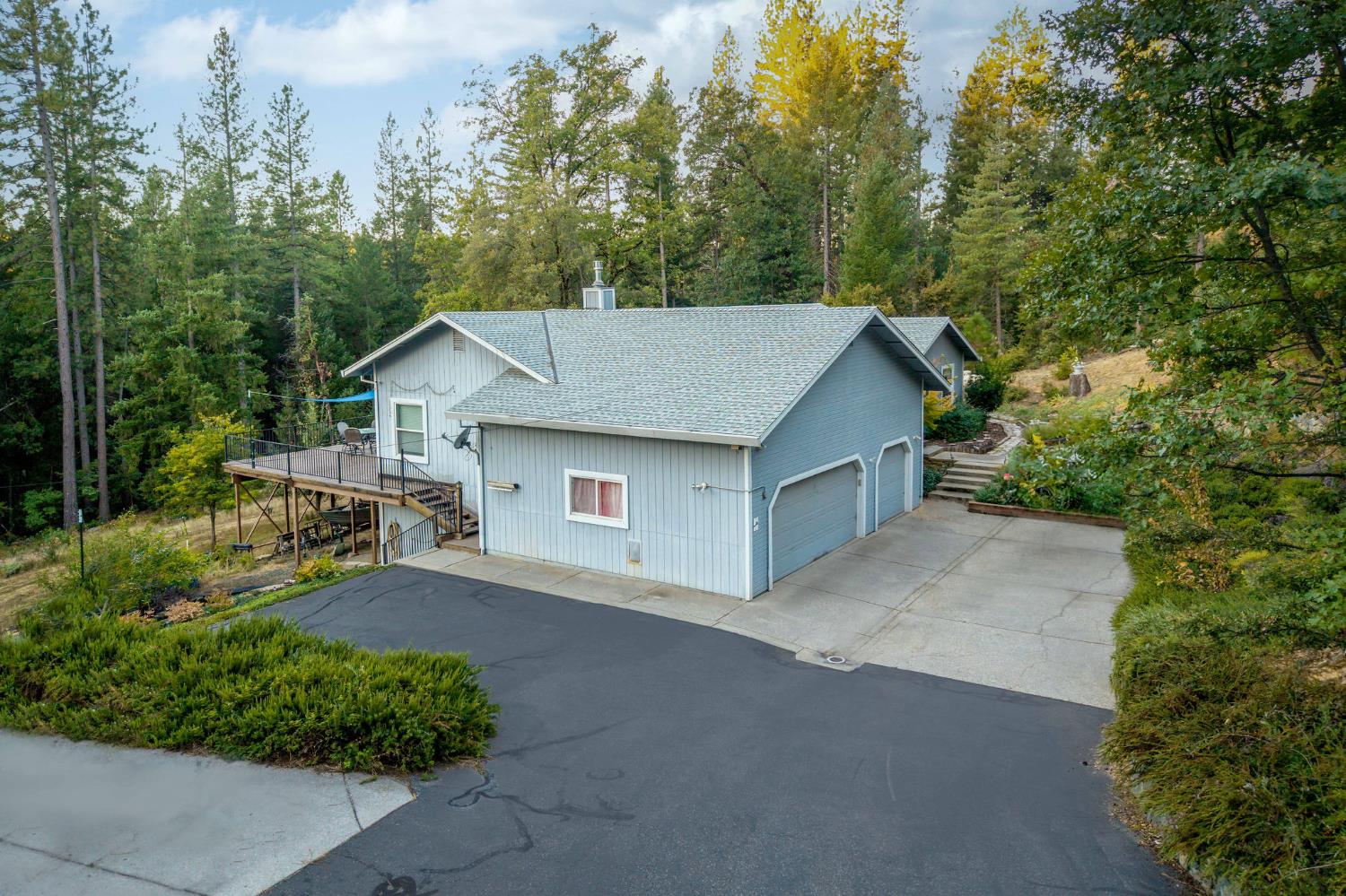 12401 Old Mine Road Grass Valley, CA 95945 - Photo 23 of 87 a view of a house with a yard and large trees