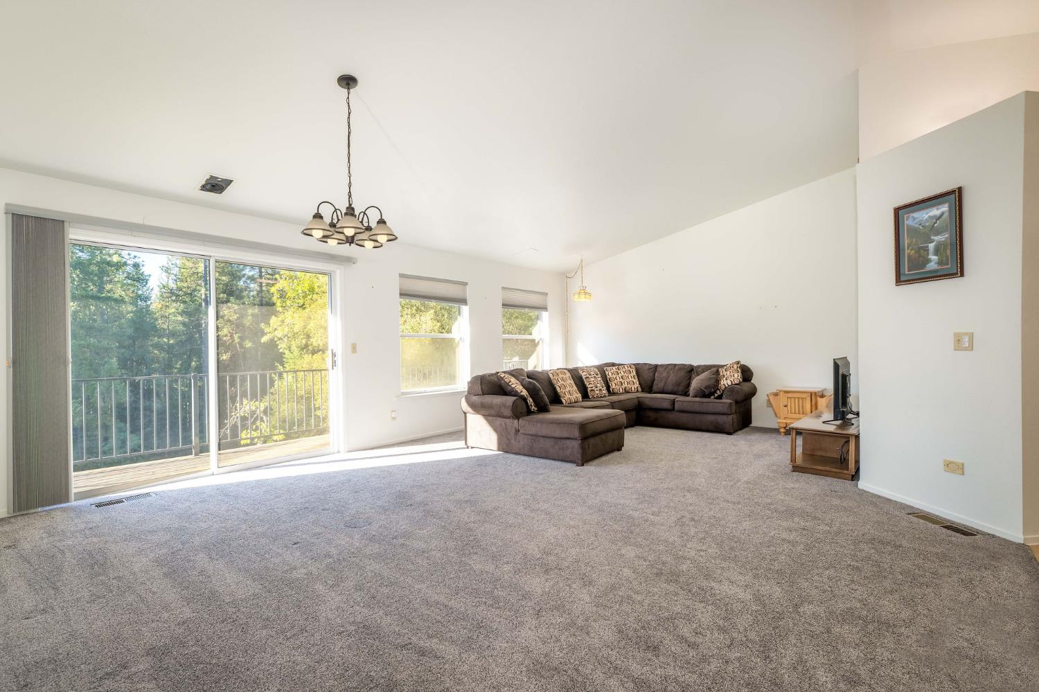12401 Old Mine Road Grass Valley, CA 95945 - Photo 26 of 87 a living room with furniture and large windows