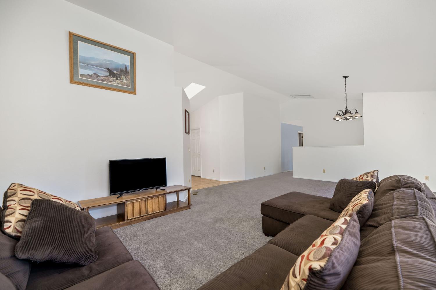 12401 Old Mine Road Grass Valley, CA 95945 - Photo 29 of 87 a living room with furniture and a flat screen tv