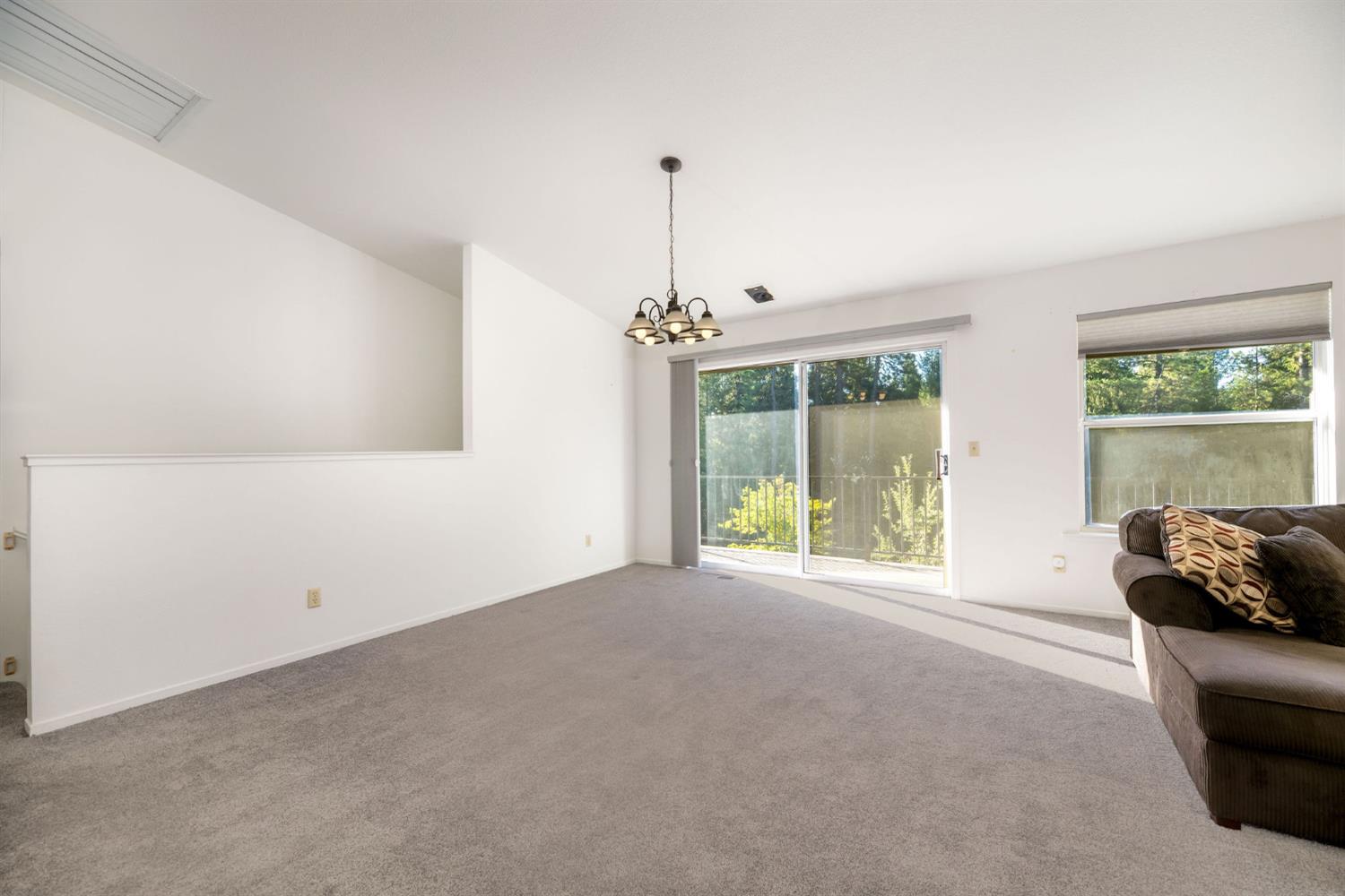12401 Old Mine Road Grass Valley, CA 95945 - Photo 30 of 87 a living room with furniture and a window