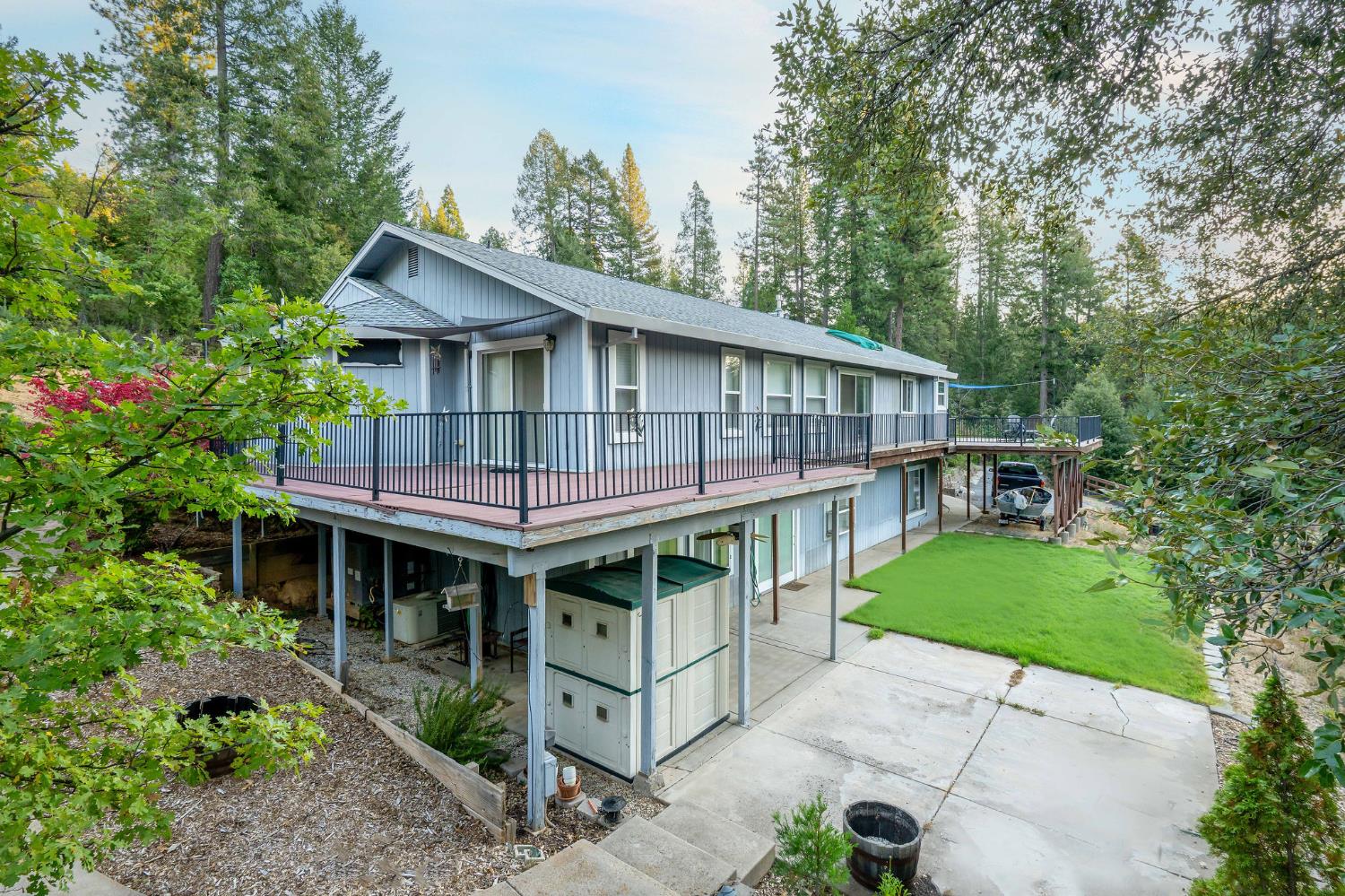 12401 Old Mine Road Grass Valley, CA 95945 - Photo 4 of 87 a view of house with a yard and potted plants