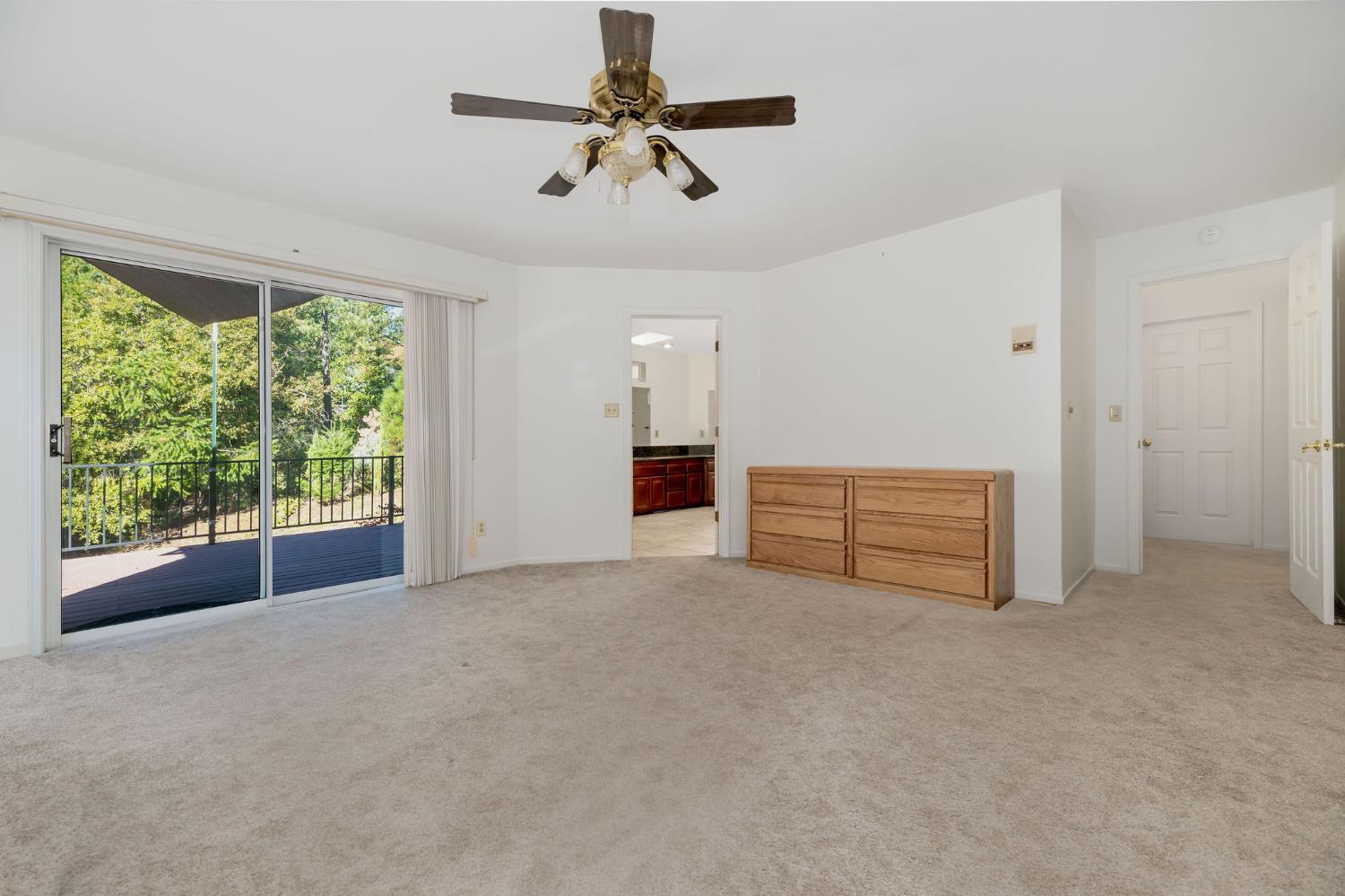 12401 Old Mine Road Grass Valley, CA 95945 - Photo 43 of 87 a view of empty room with ceiling fan and window