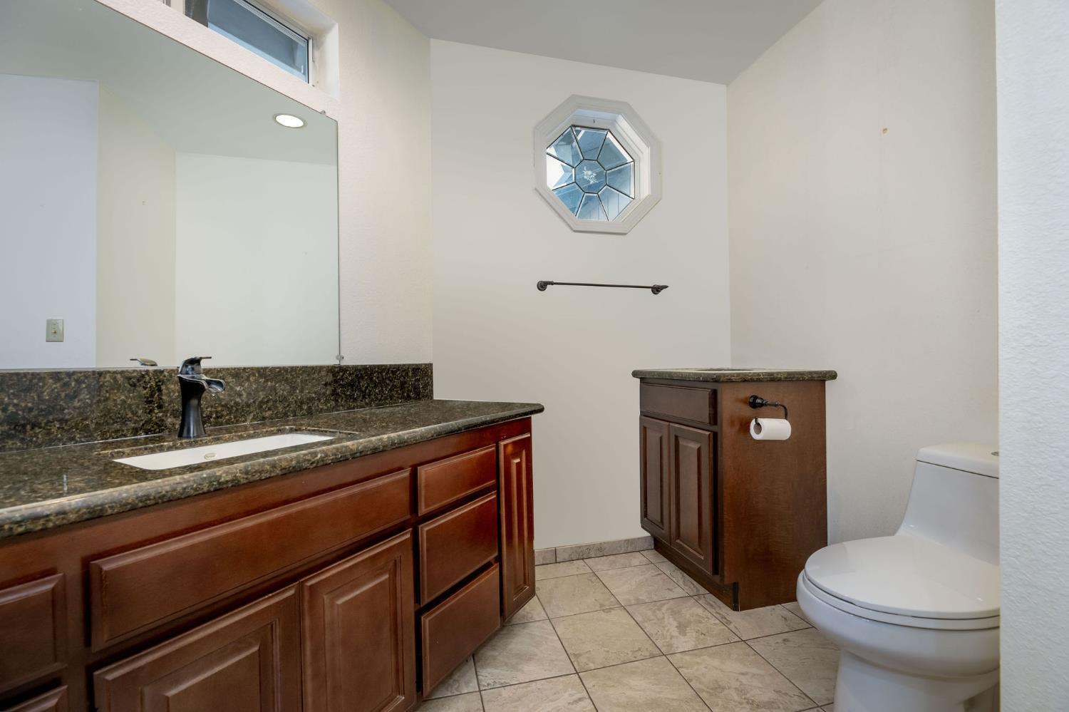 12401 Old Mine Road Grass Valley, CA 95945 - Photo 45 of 87 a bathroom with a toilet a sink and mirror
