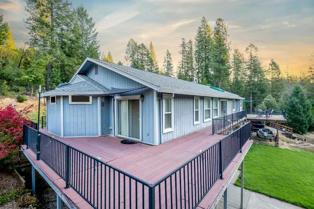 a view of a wooden fence next to a yard