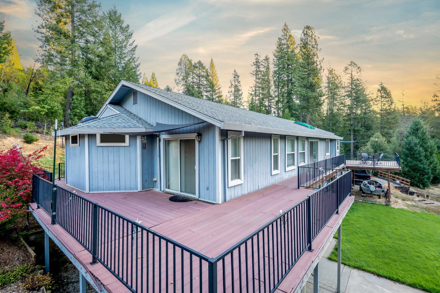 12401 Old Mine Road Grass Valley, CA 95945 - Photo 5 of 87 a view of a house that has small yard and large trees