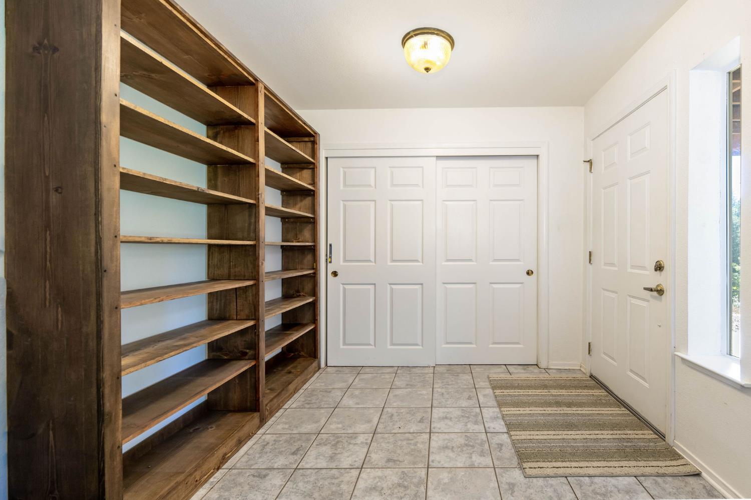 12401 Old Mine Road Grass Valley, CA 95945 - Photo 60 of 87 a view of walk in closet with empty racks
