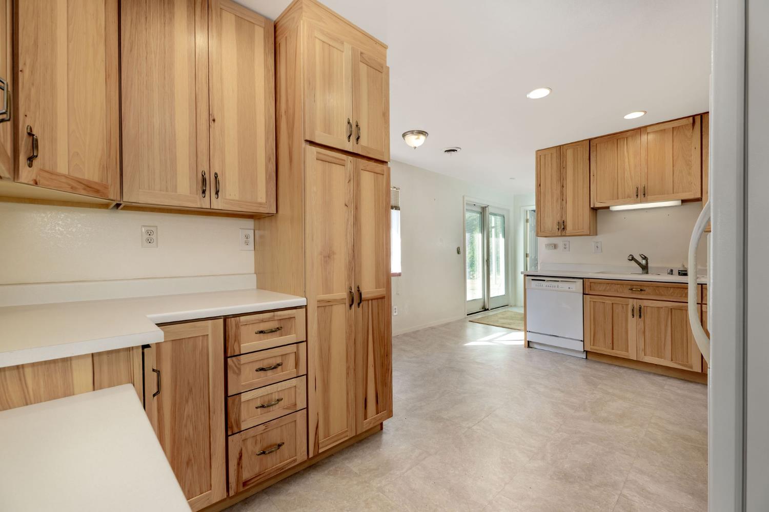 12401 Old Mine Road Grass Valley, CA 95945 - Photo 62 of 87 a kitchen with stainless steel appliances a refrigerator and a stove