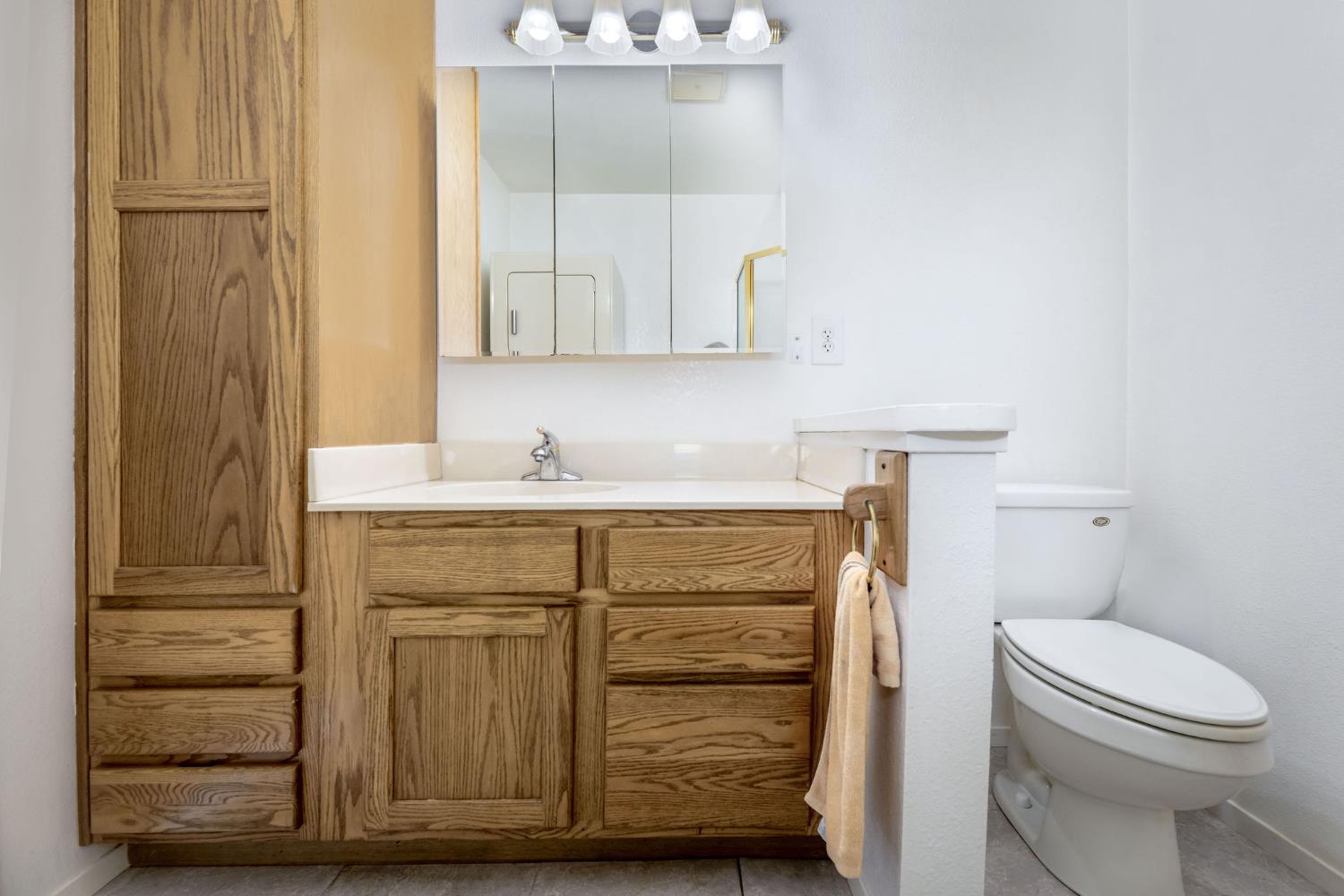 12401 Old Mine Road Grass Valley, CA 95945 - Photo 67 of 87 a bathroom with a sink a toilet and vanity