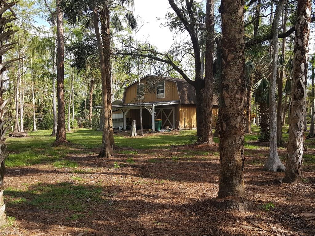 2221 Krape Road Naples, FL 34120 - Photo 11 of 24 a view of a house with a yard