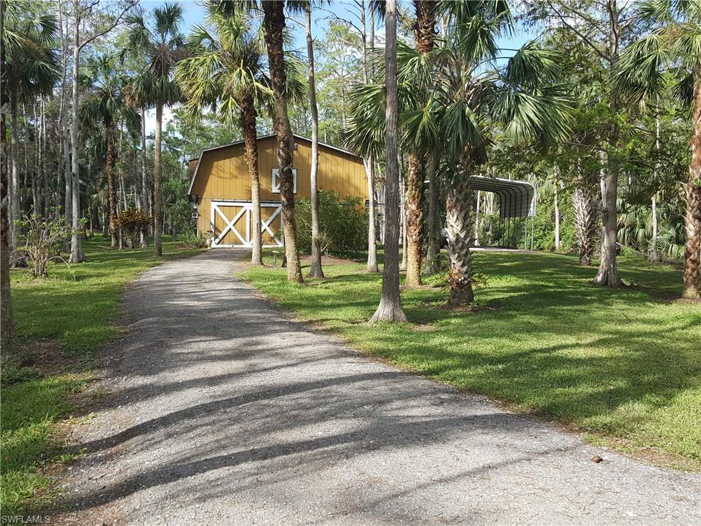 2221 Krape Road Naples, FL 34120 - Photo 12 of 24 a view of a park with large trees