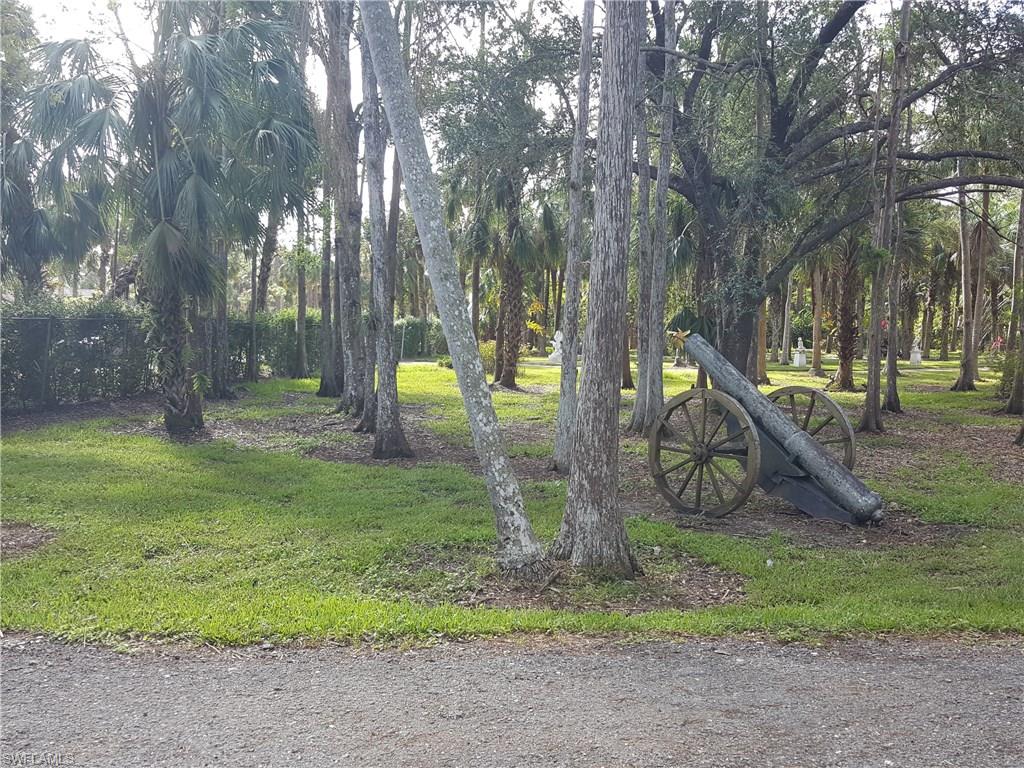 2221 Krape Road Naples, FL 34120 - Photo 19 of 24 a view of a park with swings and slides