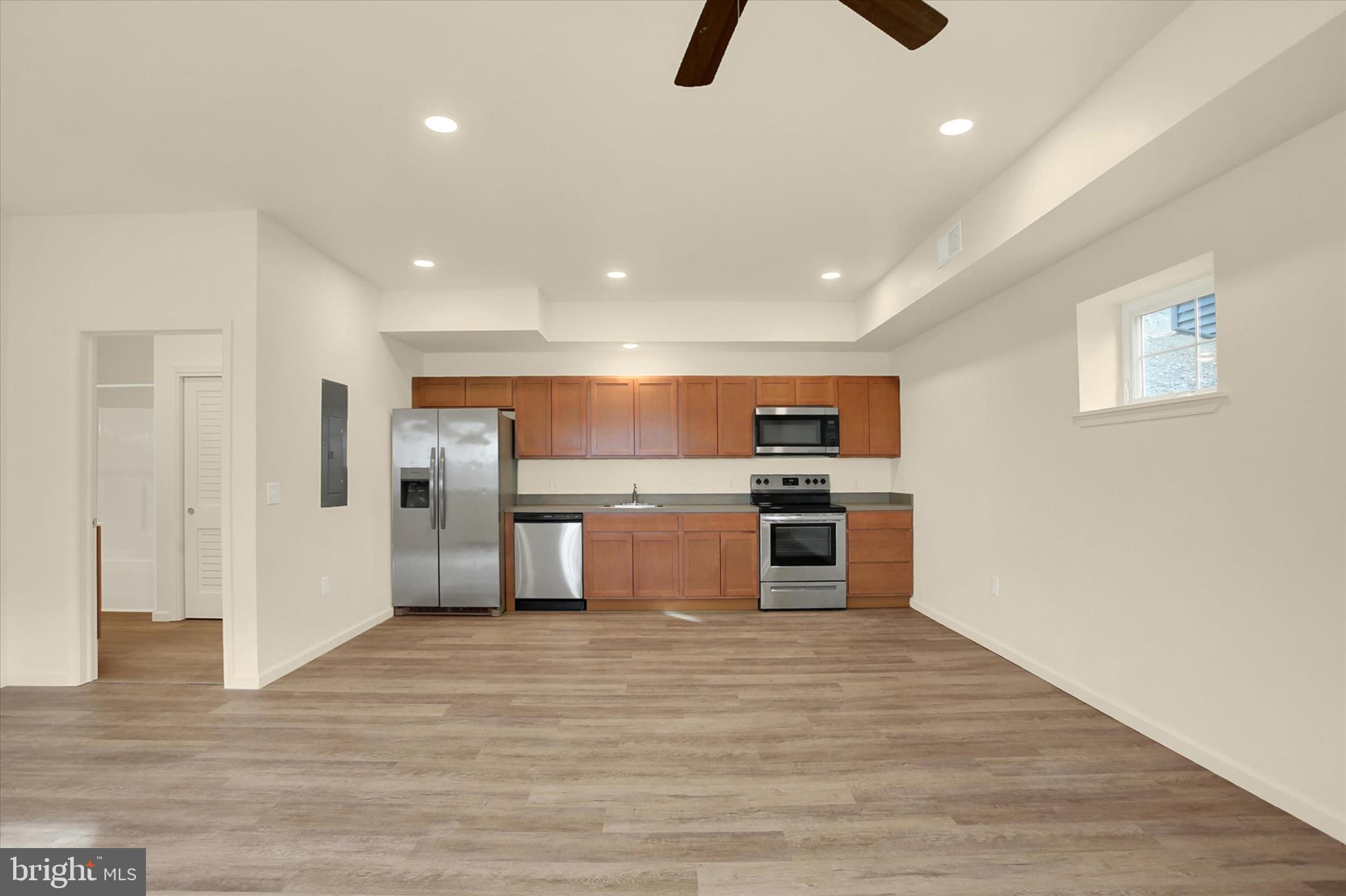 15 North 2nd Street Steelton, PA 17113 - Photo 4 of 16 a kitchen with stainless steel appliances a stove and wooden floor