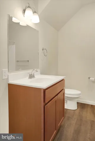 a bathroom with a sink toilet and vanity
