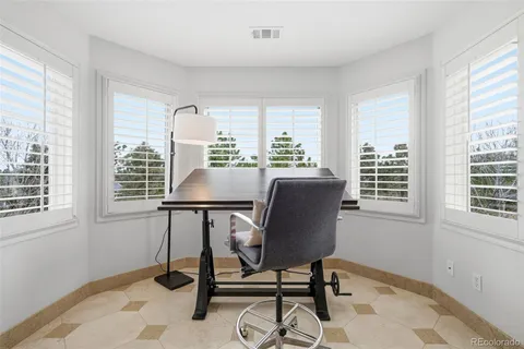 a large bathroom with a sink mirror and a bath tub