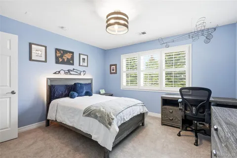 a bed room with a bed and a window