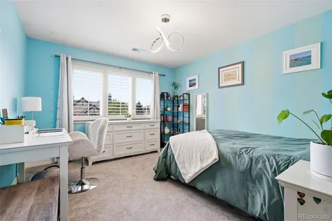 a view of a living room and kitchen with furniture