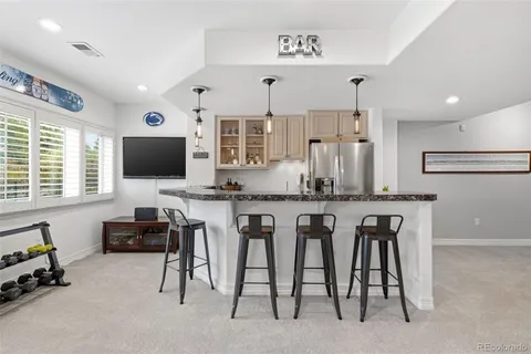 a front view of a house with a yard table and chairs