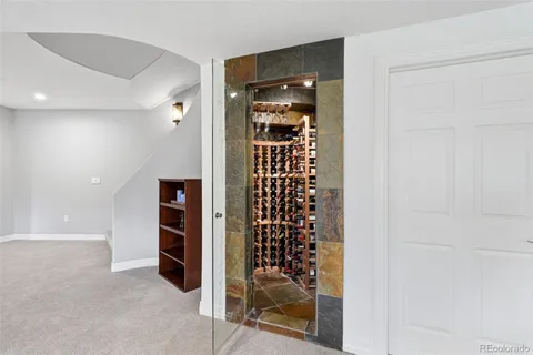 a view of a chairs and table in patio next to a yard