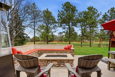 a sitting area with furniture and wooden floor
