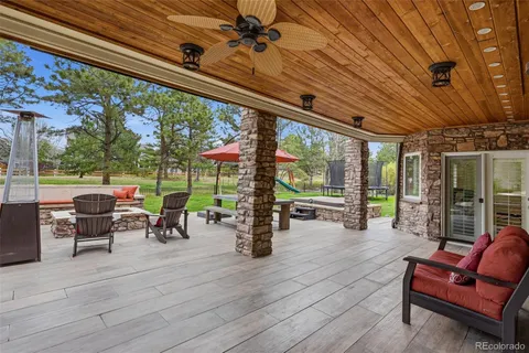 a view of a backyard with sitting area