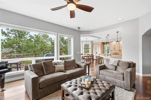 a large kitchen with a table and chairs