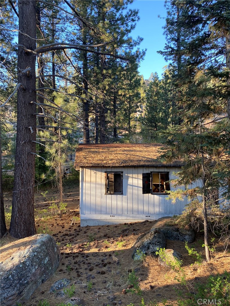 0 Cienega Road Big Bear Lake, CA 92315 - Photo 16 of 29 a front view of a house with a yard