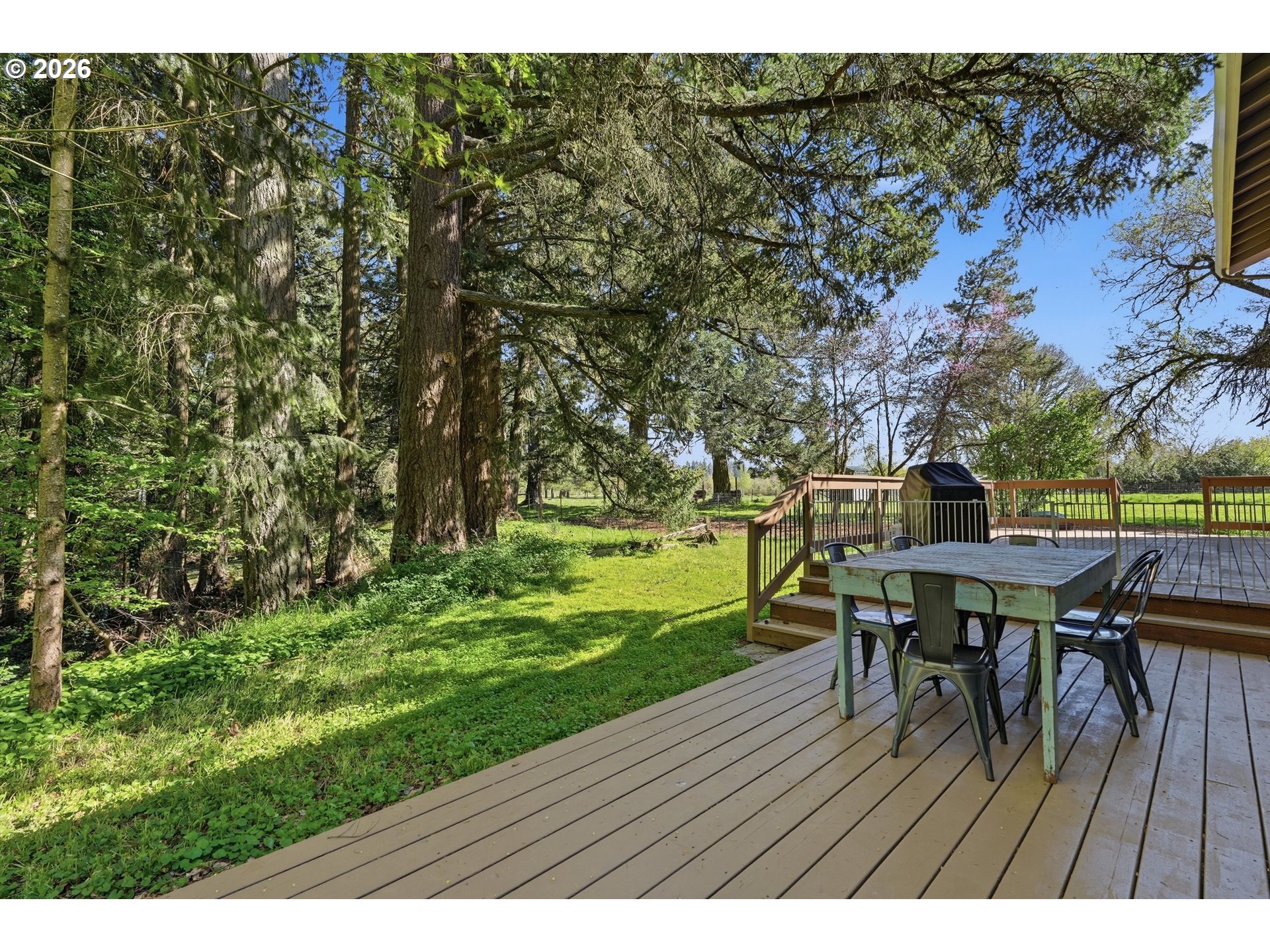 23032 Northeast Hagey Road Dundee, OR 97115 - Photo 38 of 42 a view of a table and chairs on the deck